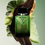 Prada Paradigme 100ML perfume bottle with sleek design and elegant cap, displayed on a neutral background.