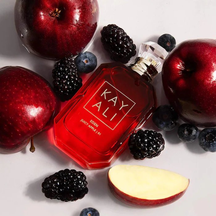 Eden Juicy Apple Kayali Eau De Parfum bottle with clear glass and gold accents, 100ml size.