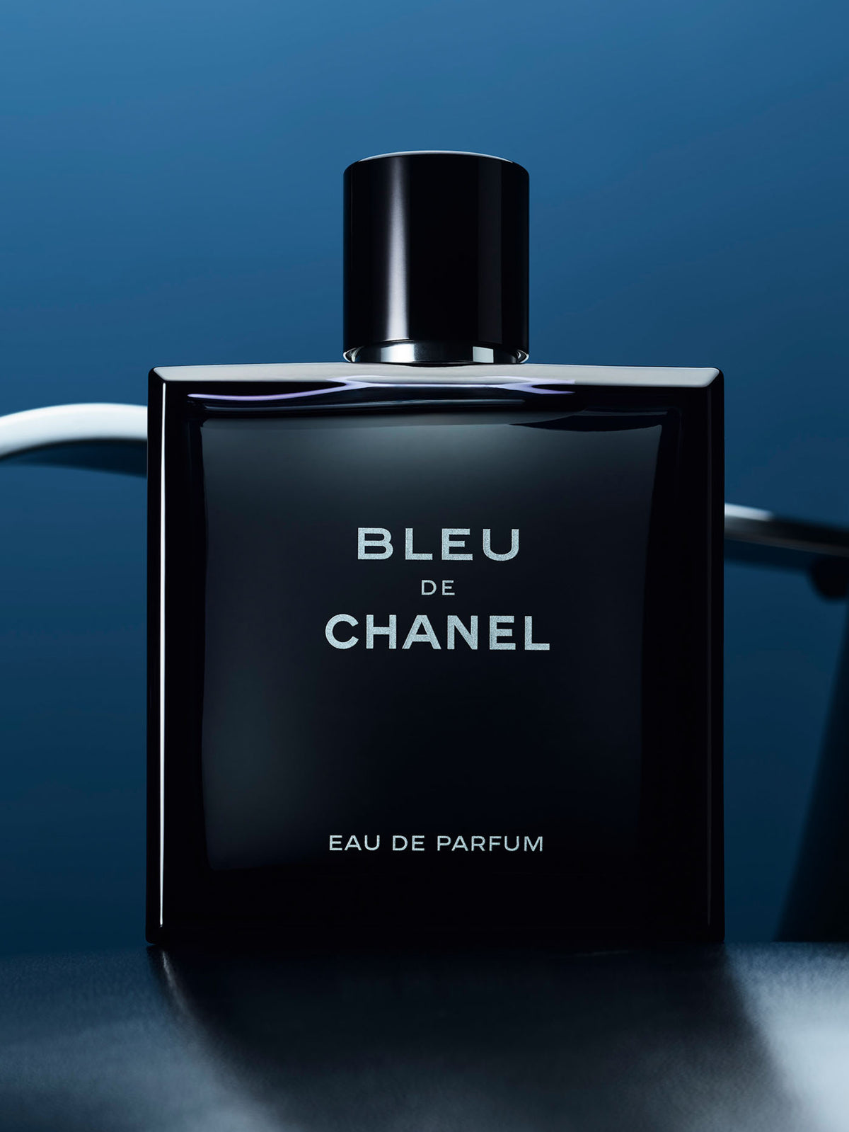 Chanel Bleu de Chanel Eau de Parfum 100ML bottle with sleek black and silver design on a white background