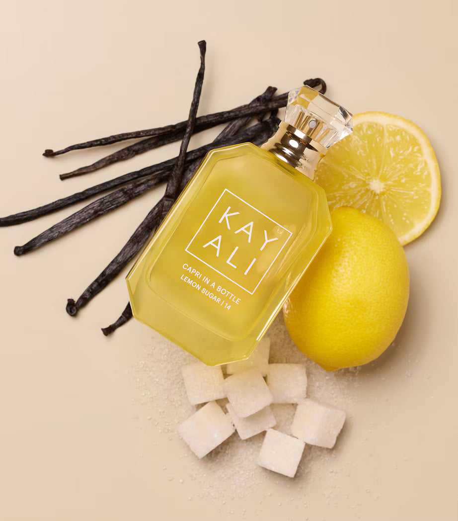 Kayali Capri in a Bottle Lemon Sugar Eau de Parfum 100ml bottle with a sleek design and vibrant yellow accents.