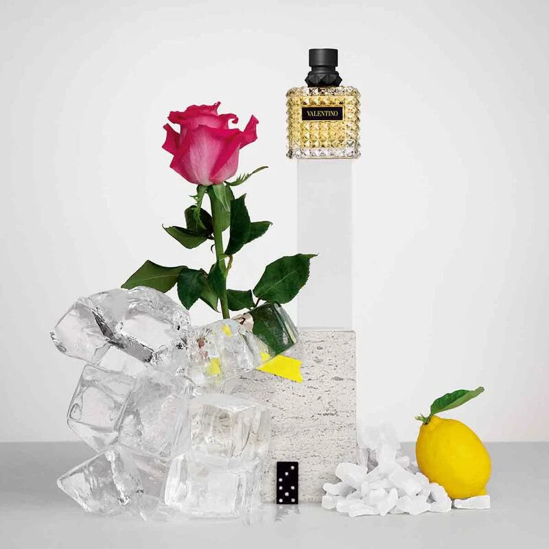 Valentino Donna Born In Roma Yellow Dream perfume bottle, 100ml, with elegant yellow and gold design, on a white background.