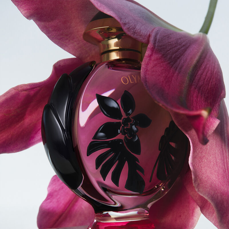 Rabanne Olympéa Flora fragrance bottle, 80ML, with elegant floral design and silver cap, showcased against a neutral background.