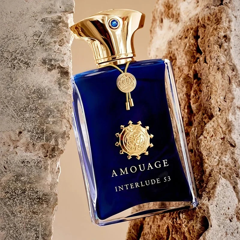 Amouage Interlude 53 Man perfume bottle with sleek design, 100ML size, featuring elegant gold accents and black cap.
