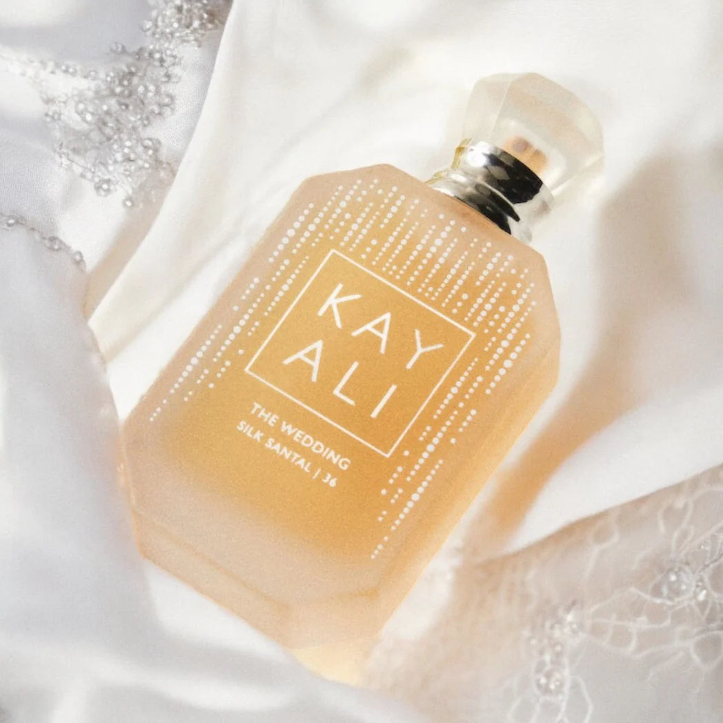 Kayali The Wedding Silk Santal perfume bottle, 100ml, with elegant packaging and floral accents, showcasing the luxurious fragrance.