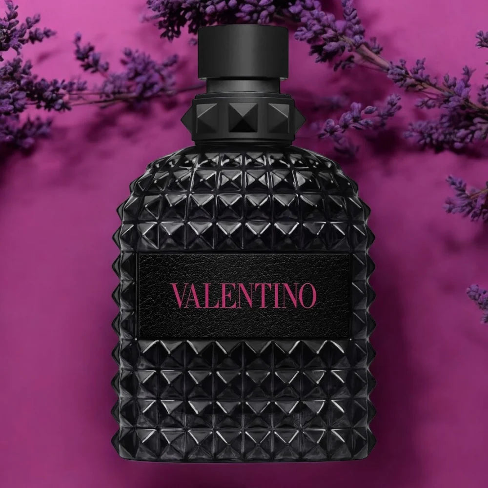 Valentino Born in Roma Extradose Uomo 100ML men's fragrance bottle with sleek design and black cap, displayed on a neutral background.