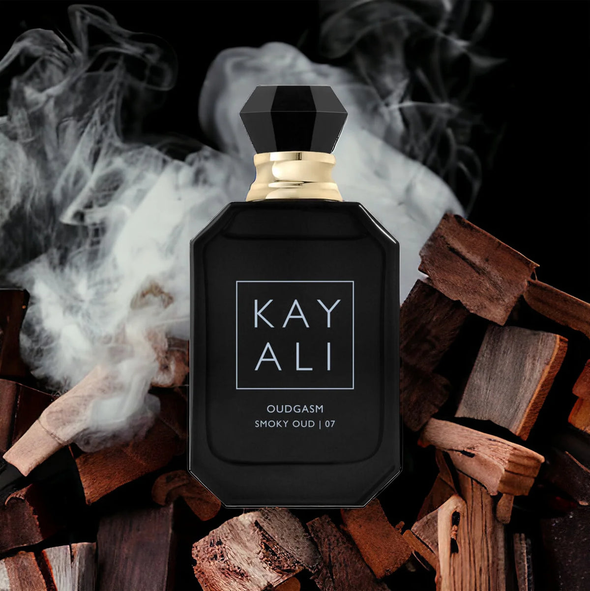 Kayali Oudgasm Smoky Oud perfume bottle, 100ml, featuring dark, smoky glass and elegant design, representing Kayali's luxurious fragrance.