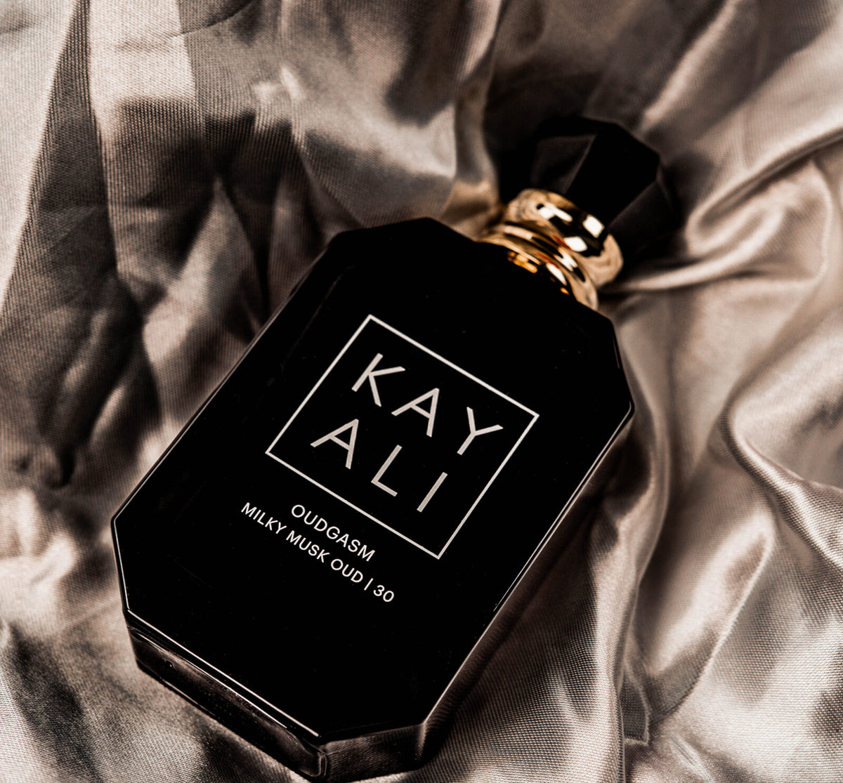 Kayali Oudgasm Milky Musk Oud fragrance bottle with 100ml size, showcasing the elegant design of the Kayali perfume.