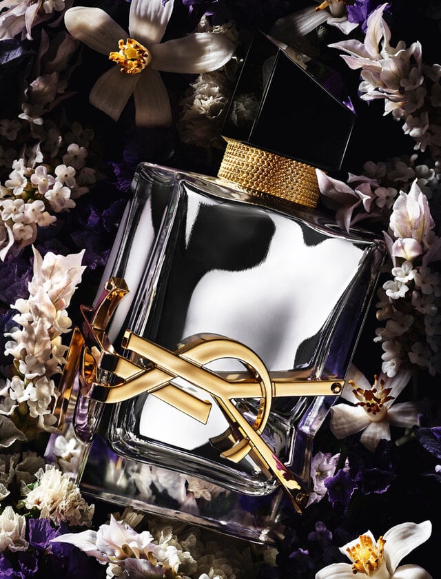 Yves Saint Laurent Libre L'Absolu Platine 90ML perfume bottle with gold accents, showcasing elegant packaging and floral design elements.