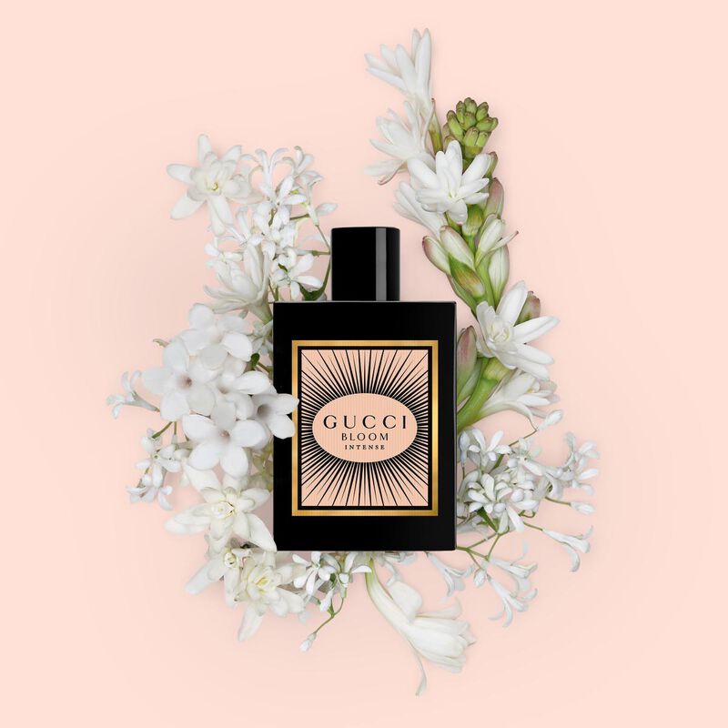 Gucci Bloom Intense perfume bottle, 100ml, featuring elegant floral design and branding, showcasing the luxurious fragrance packaging.