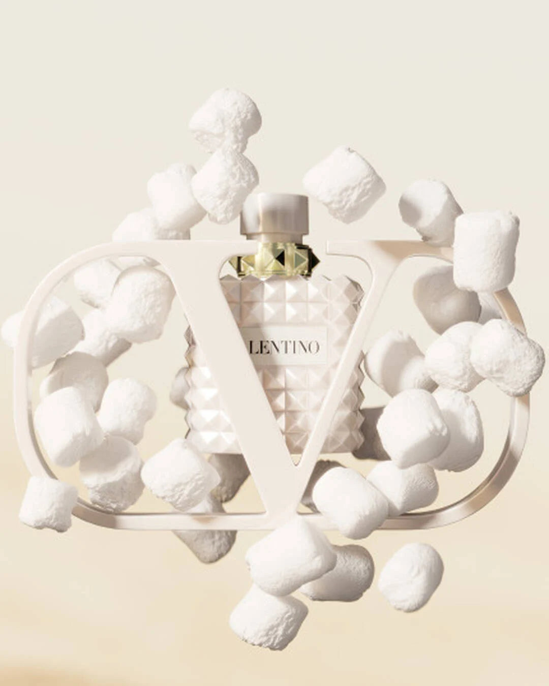 Valentino Donna Born in Roma Ivory perfume bottle with elegant design, 100ml size, showcasing the luxurious fragrance packaging.