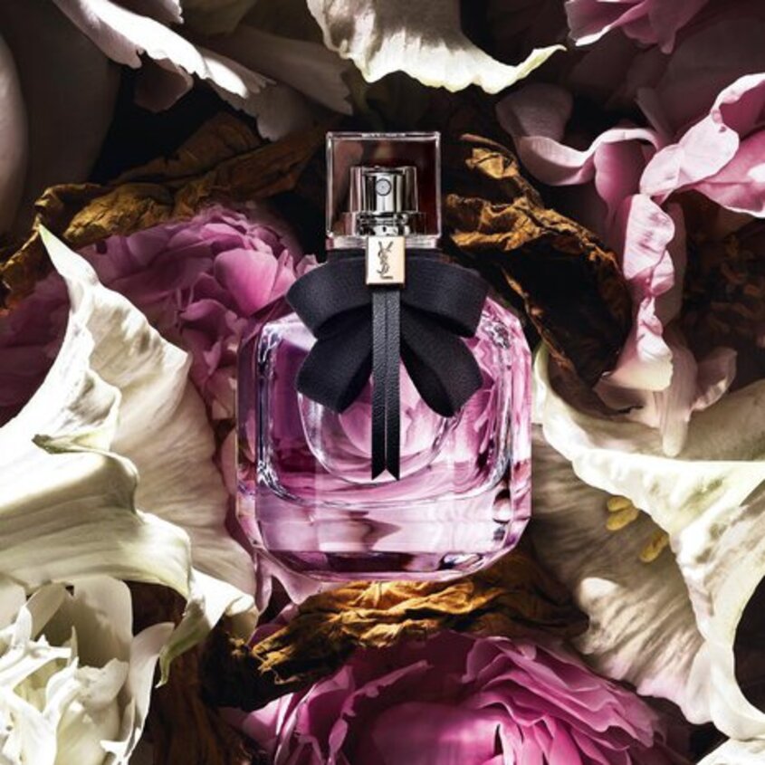 Yves Saint Laurent Mon Paris 90ml perfume bottle with elegant pink and gold design on a white background
