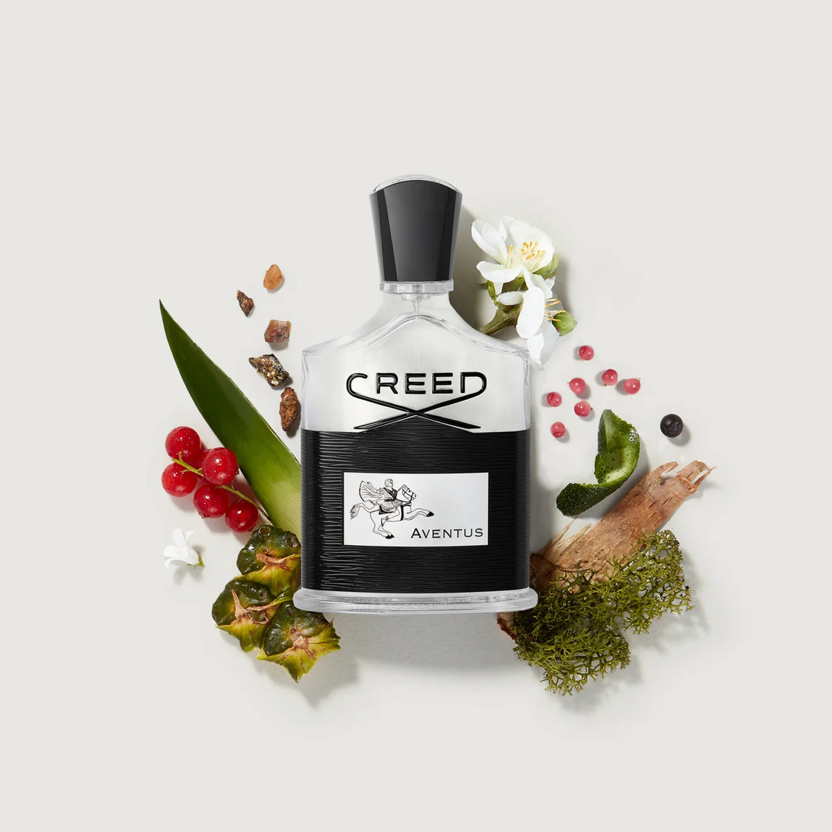 Close-up of Creed Aventus 100ML perfume bottle showing the label and elegant design.
