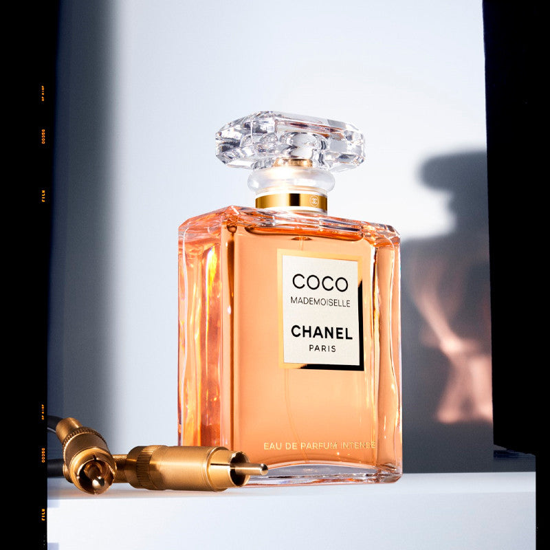 Chanel Coco Mademoiselle Intense 100ML Eau de Parfum vaporizer bottle with elegant design and floral fragrance details.