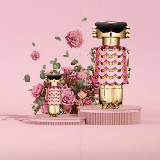 Fame Blooming Pink Eau de Parfum by Rabanne, 80ml bottle with pink floral design and elegant spray nozzle.