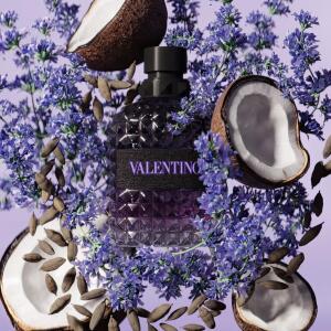 Valentino Uomo Born in Roma Melancholia perfume bottle in purple with silver cap, 100ml, on a neutral background.
