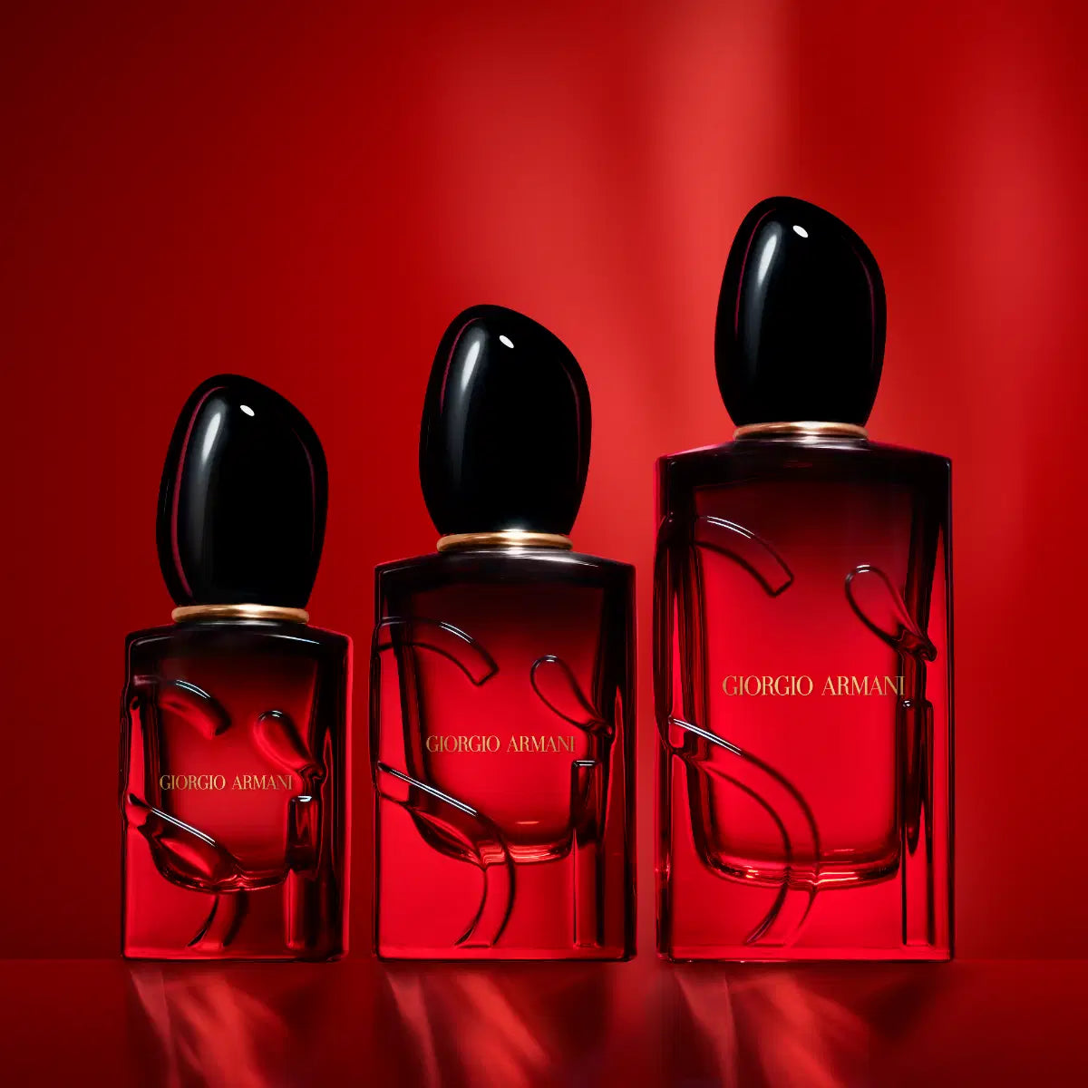 Giorgio Armani Sì Passione Eau de Parfum Intense bottle with elegant pink and gold design on a white background