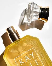 Kayali Capri in a Bottle Lemon Sugar 14 Eau de Parfum bottle, 100ml, with a sleek design and vibrant yellow accents.