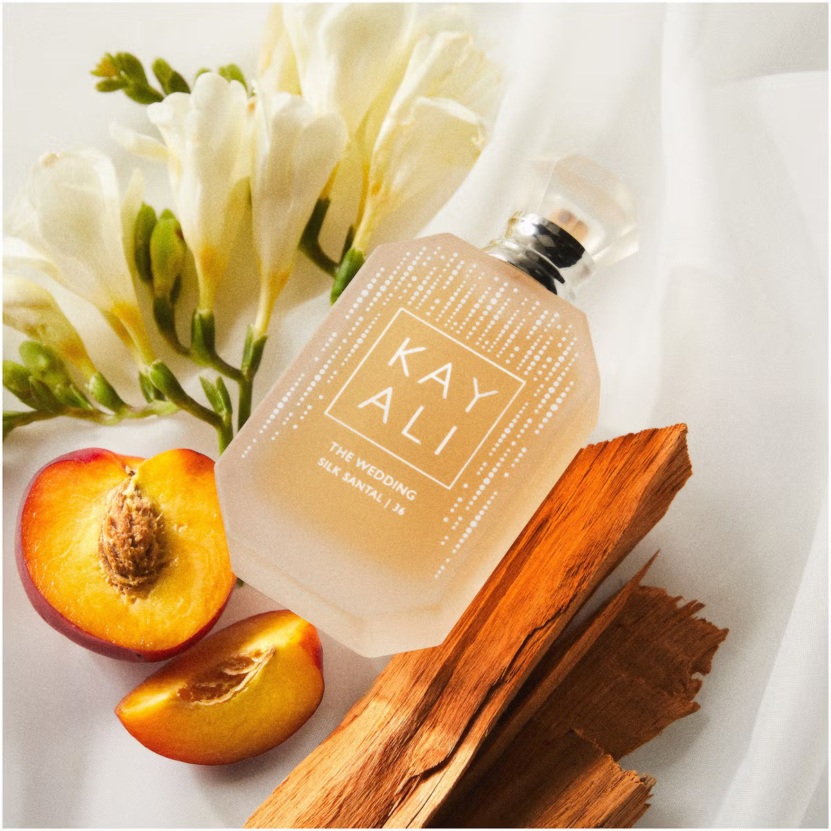 Kayali The Wedding Silk Santal perfume bottle with 36 Kayali fragrances, 100ml, elegant design and luxurious packaging.