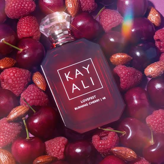 Kayali Lovefest Burning Cherry 48 Eau de Parfum bottle with cherry-colored liquid in a sleek 100ml spray container.