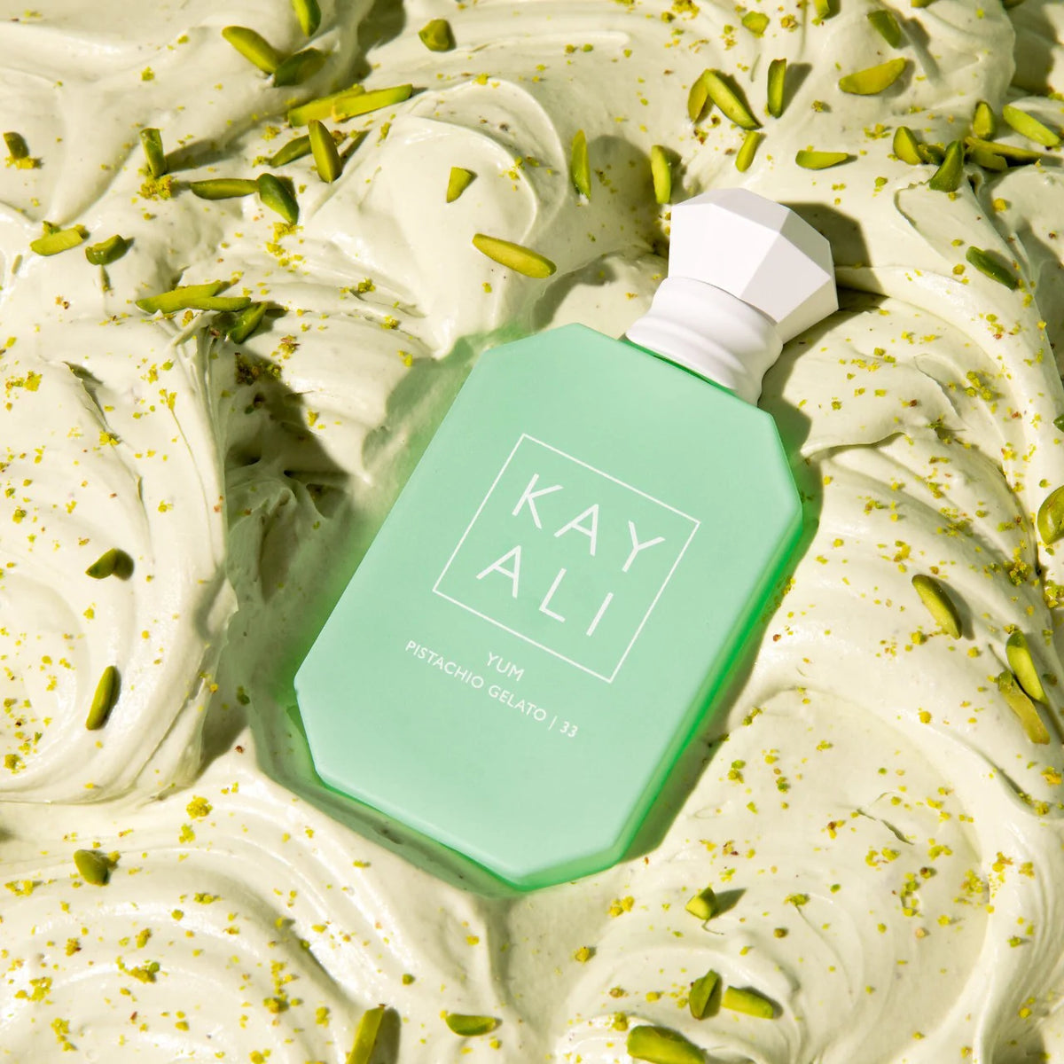 Kayali Yum Pistachio Gelato 100ml fragrance bottle with a sleek design, showcasing a luxurious perfume for women.