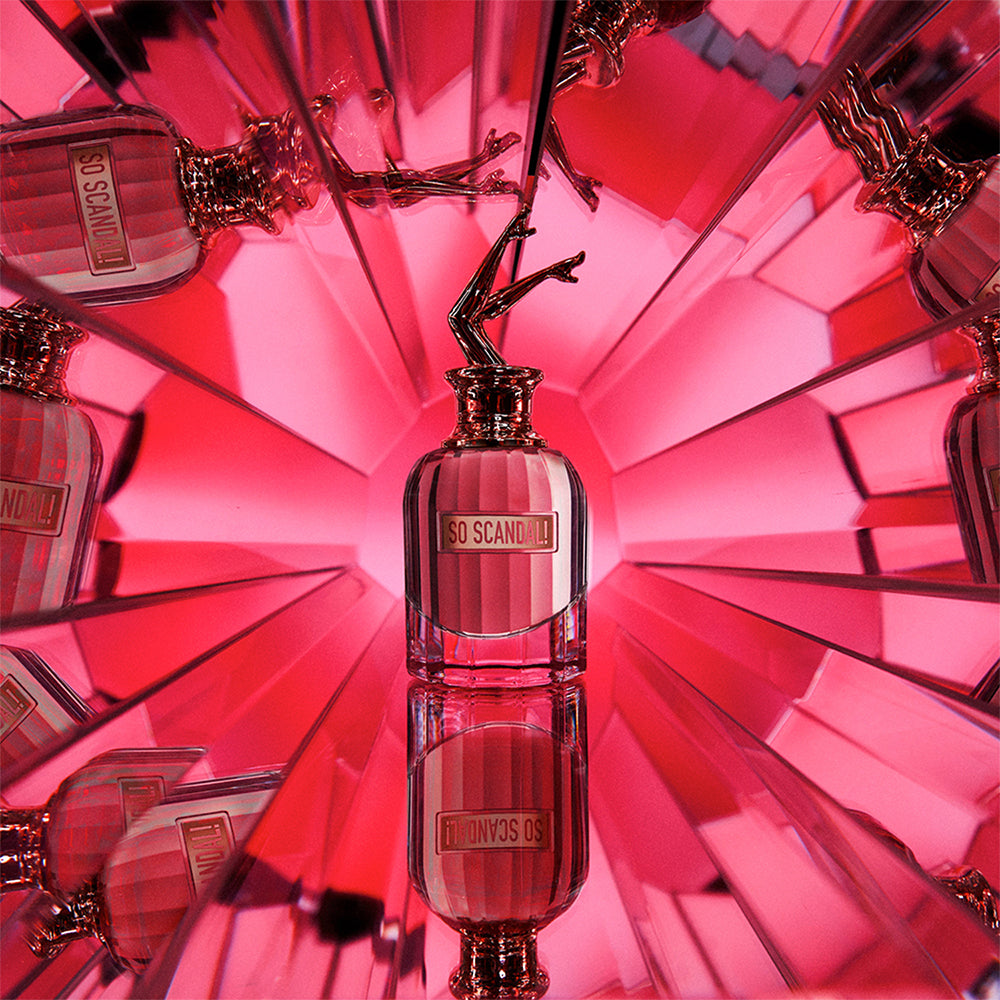 Jean Paul Gaultier So Scandal perfume bottle, 80ml, with sleek design and floral accents, displayed on a neutral background.