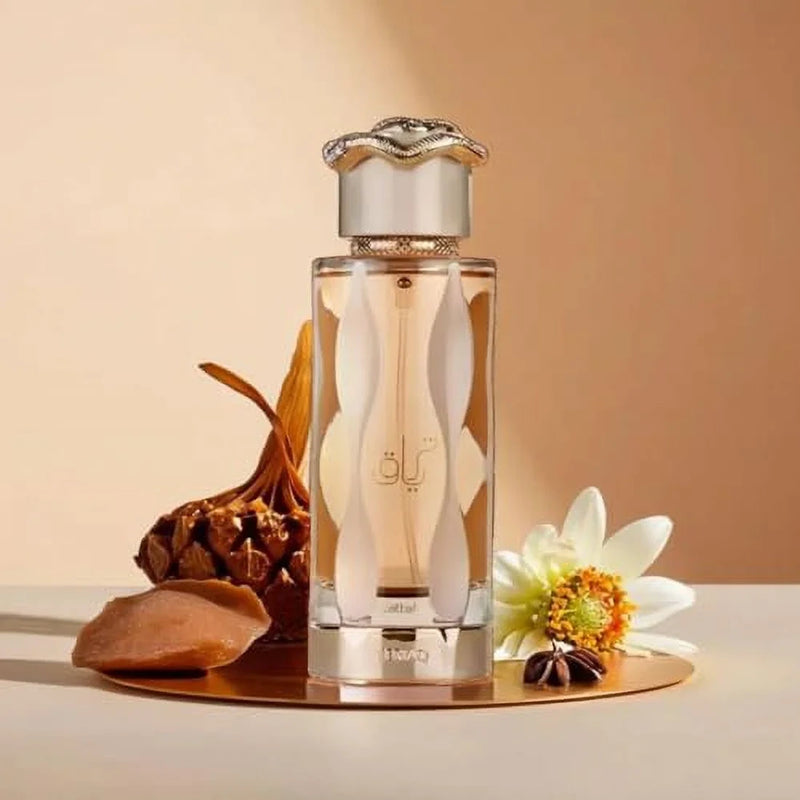 Lattafa Teriaq perfume bottle with elegant 100ML glass design and silver cap, showcasing luxurious fragrance packaging.
