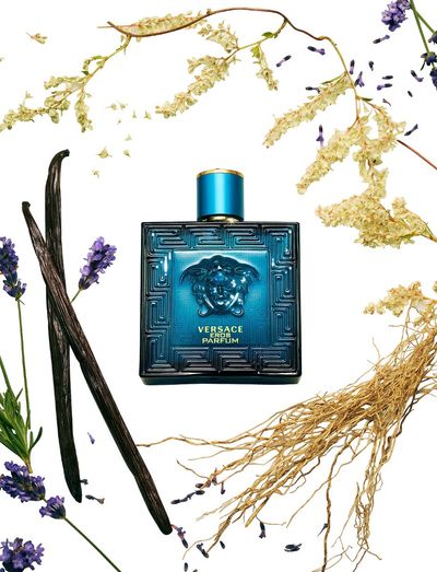 Versace Eros Parfum 100ML bottle with intricate design, featuring a sleek, elegant shape and gold accents.