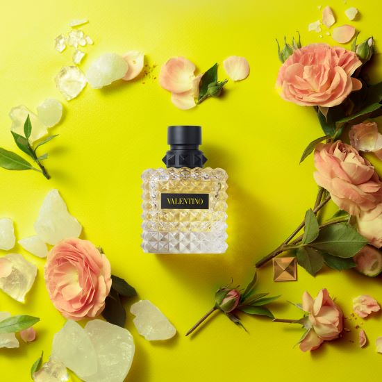 Valentino Donna Born In Roma Yellow Dream perfume bottle with yellow accents, elegant design, and floral details.