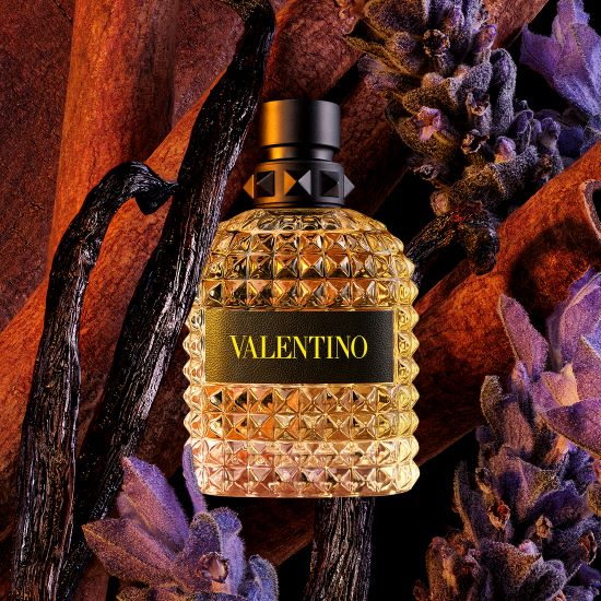 Valentino Uomo Born In Roma Yellow Dream perfume bottle with yellow accents, showcasing the fragrance's elegant design and branding.