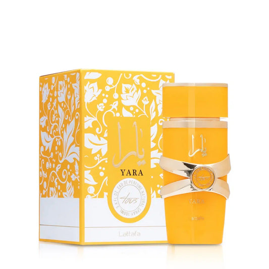 Lattafa Yara Tous 100ml perfume bottle with elegant design and clear branding, displayed against a neutral background.