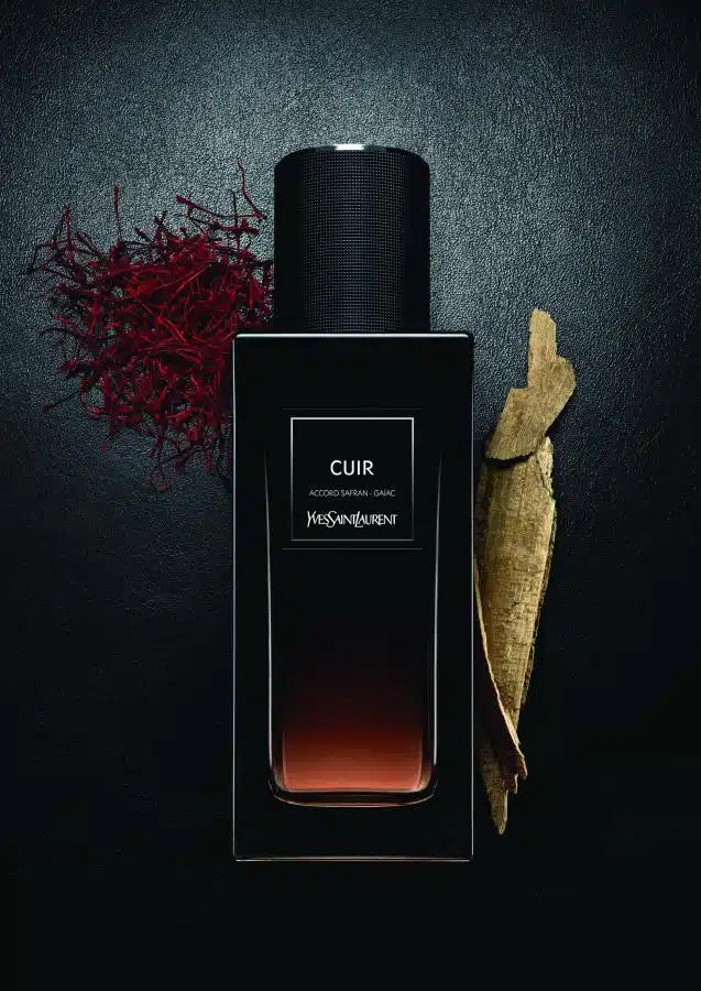 Yves Saint Laurent Cuir perfume bottle, 125ml, with elegant black and gold design, showcasing the luxurious fragrance.